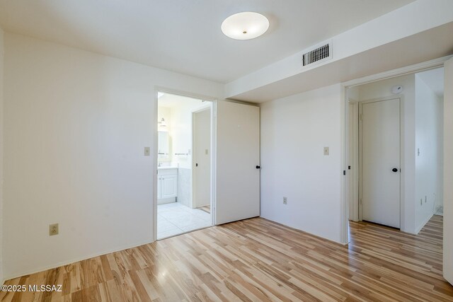 unfurnished room featuring light hardwood / wood-style floors