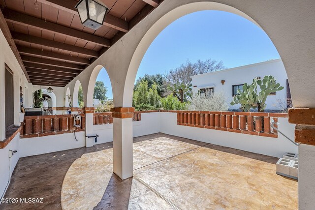 rear view of property featuring covered porch