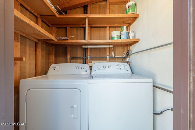 laundry room with laundry area and washer and clothes dryer