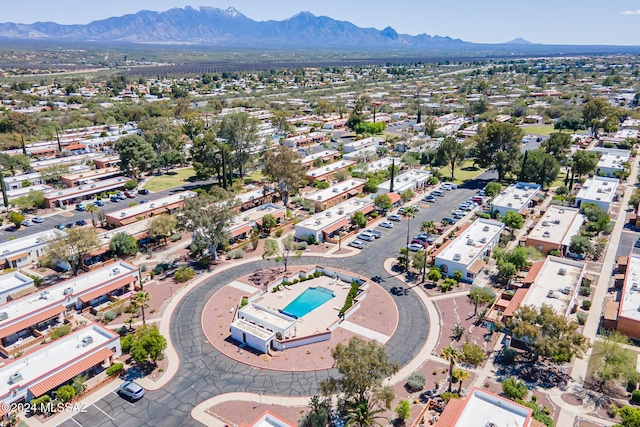 birds eye view of property with a mountain view