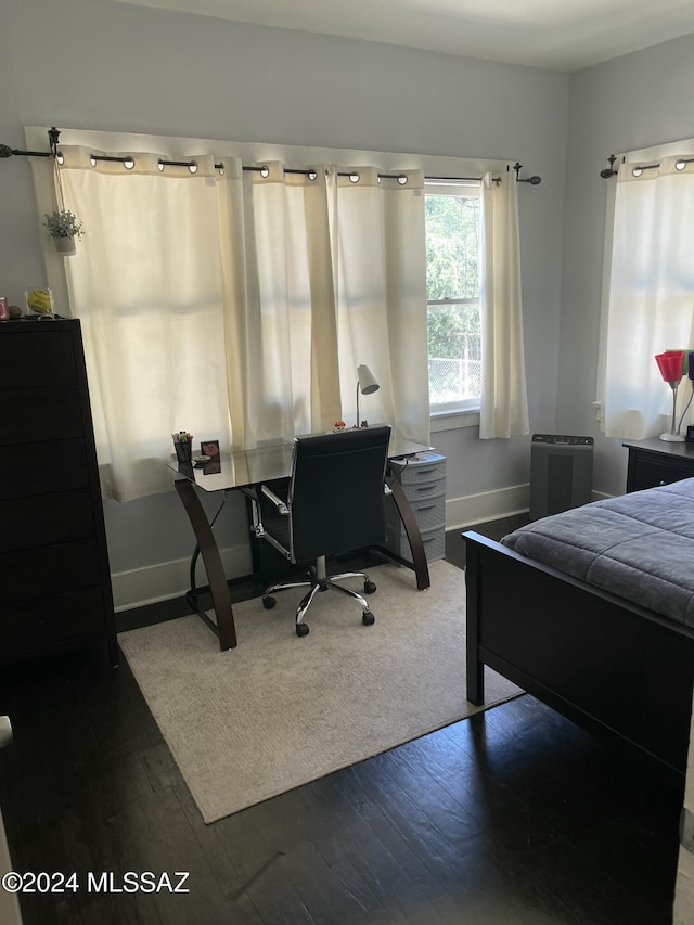 bedroom featuring wood-type flooring