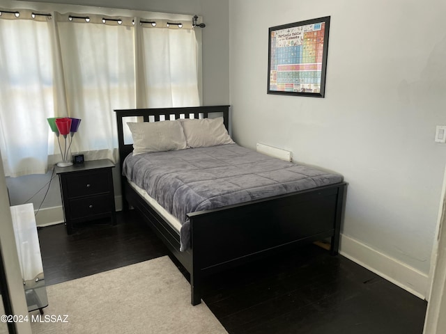 bedroom featuring dark hardwood / wood-style floors