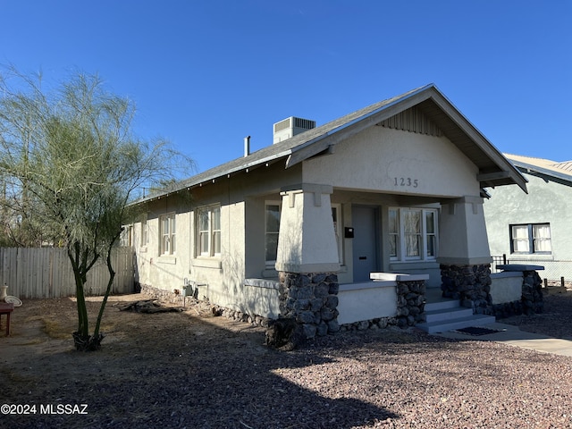 view of front of home featuring a porch and central air condition unit