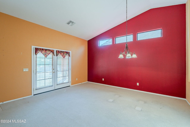 unfurnished room with carpet floors, an inviting chandelier, and lofted ceiling