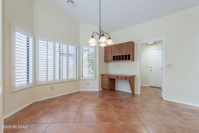 1474 N Miranda Ln, Green Valley, AZ 85614 - unfurnished dining area featuring light tile patterned floors, visible vents, a notable chandelier, and baseboards