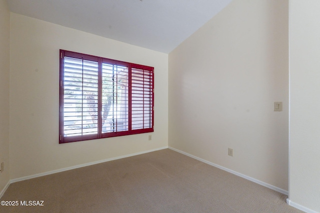 1474 N Miranda Ln, Green Valley, AZ 85614 - spare room featuring baseboards and carpet floors