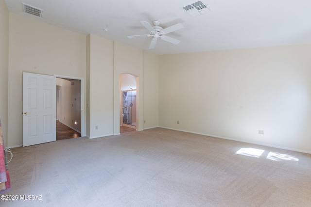 1474 N Miranda Ln, Green Valley, AZ 85614 - unfurnished bedroom featuring arched walkways, visible vents, carpet floors, and baseboards
