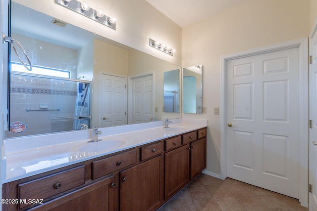 1474 N Miranda Ln, Green Valley, AZ 85614 - bathroom featuring tile patterned floors, a tile shower, double vanity, and a sink