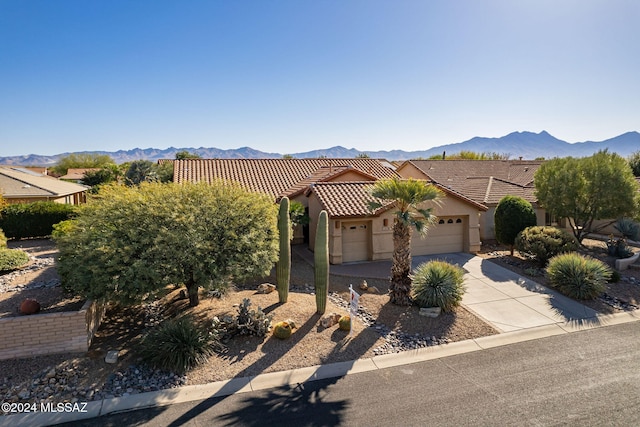 view of front of house with a mountain view and a garage