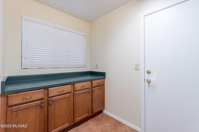 1474 N Miranda Ln, Green Valley, AZ 85614 - clothes washing area featuring baseboards and light tile patterned flooring