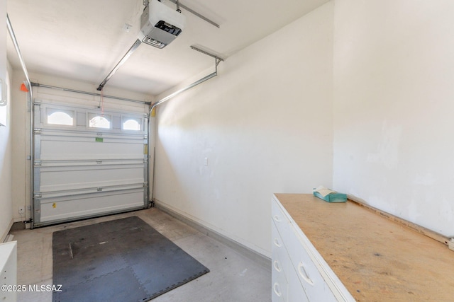 1474 N Miranda Ln, Green Valley, AZ 85614 - garage with a garage door opener and baseboards