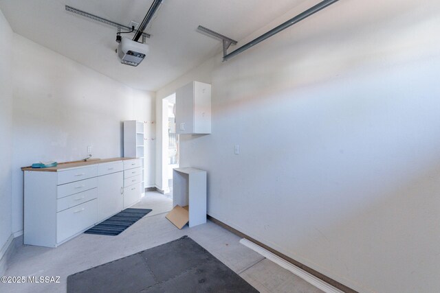 1474 N Miranda Ln, Green Valley, AZ 85614 - garage with baseboards and a garage door opener