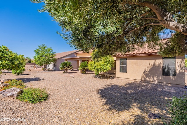 1474 N Miranda Ln, Green Valley, AZ 85614 - rear view of house featuring stucco siding and a tile roof