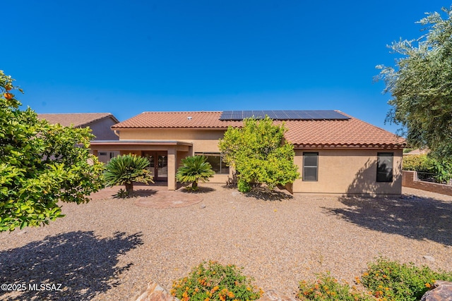 1474 N Miranda Ln, Green Valley, AZ 85614 - view of front of property with solar panels, stucco siding, and a tiled roof