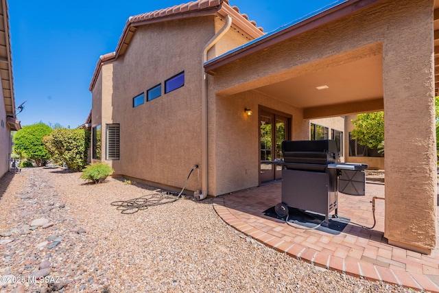1474 N Miranda Ln, Green Valley, AZ 85614 - back of house with stucco siding and a patio area