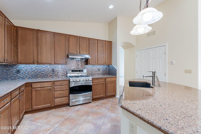 1474 N Miranda Ln, Green Valley, AZ 85614 - kitchen featuring stainless steel range with gas cooktop, decorative backsplash, a sink, visible vents, and high vaulted ceiling