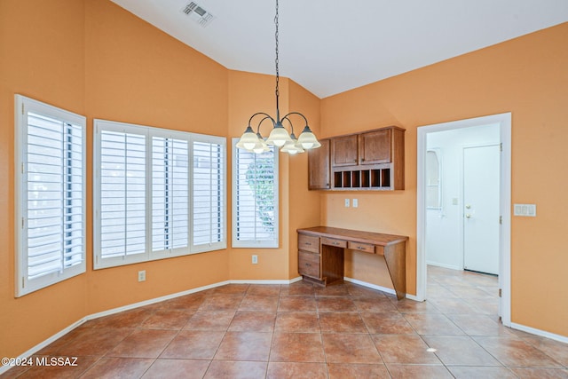 kitchen featuring pendant lighting, light tile patterned floors, high vaulted ceiling, and an inviting chandelier