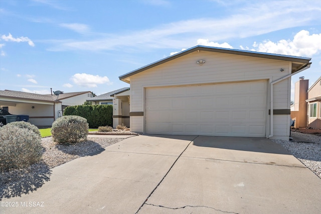 ranch-style home with an outbuilding and a garage