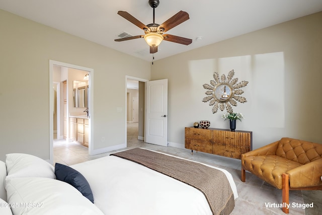 tiled bedroom with connected bathroom and ceiling fan