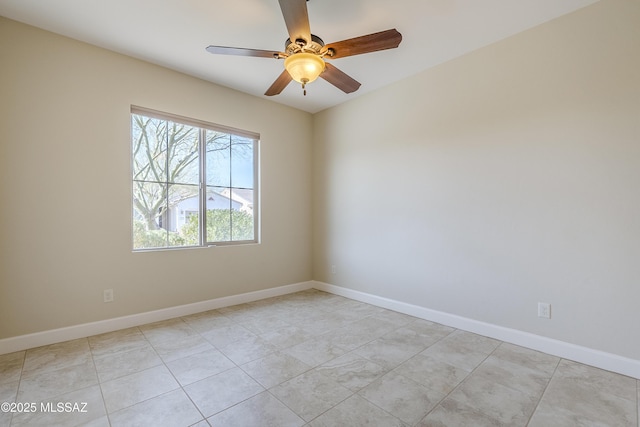 unfurnished room featuring ceiling fan and light tile patterned floors