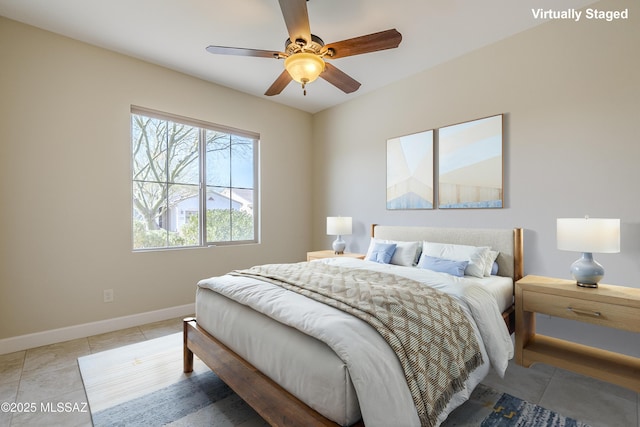 tiled bedroom with ceiling fan