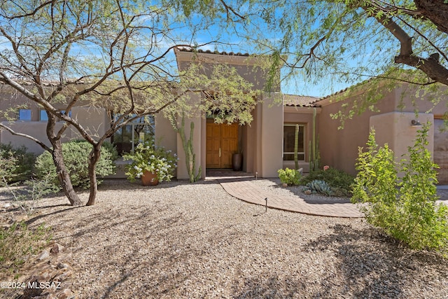 back of house with a patio