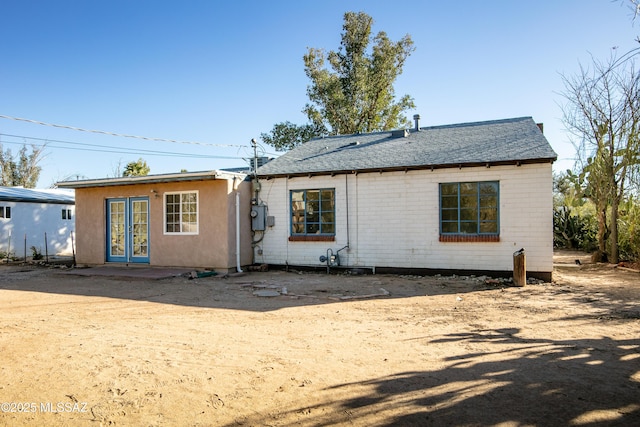 back of property featuring french doors