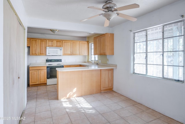 kitchen featuring ceiling fan, light brown cabinets, kitchen peninsula, white appliances, and light tile patterned floors