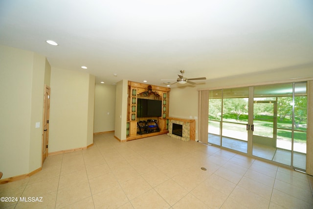 unfurnished living room with ceiling fan