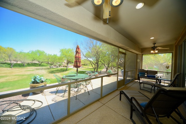 sunroom / solarium with ceiling fan