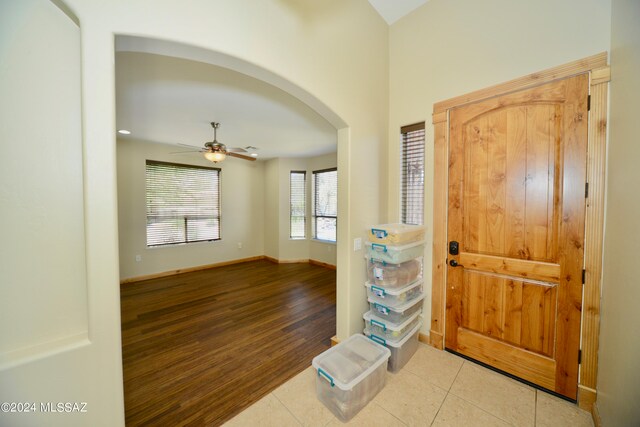 entryway with light wood-type flooring and ceiling fan