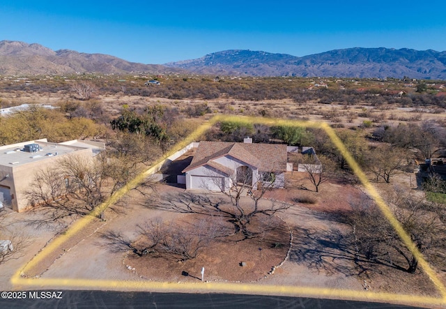 birds eye view of property with a mountain view