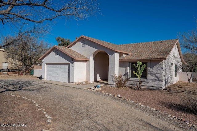 ranch-style home with a garage