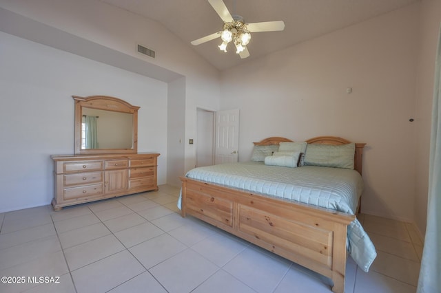 tiled bedroom featuring vaulted ceiling and ceiling fan