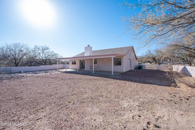 rear view of property with a patio