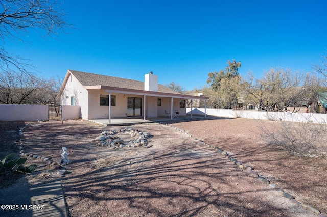 back of house with a patio area