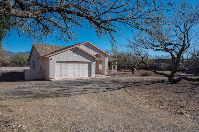 view of front of house featuring a garage and a mountain view