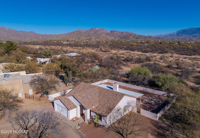 drone / aerial view featuring a mountain view