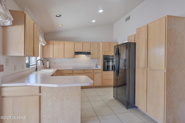 kitchen with light tile patterned flooring, light brown cabinetry, black appliances, sink, and kitchen peninsula