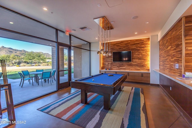 game room with recessed lighting, visible vents, a mountain view, and finished concrete flooring