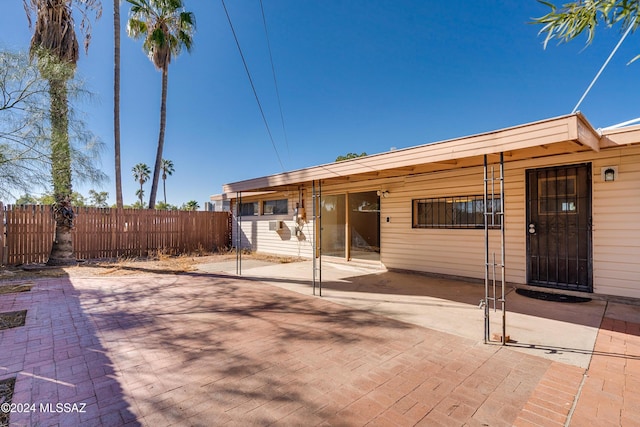 rear view of property with a patio