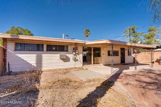 rear view of property featuring a patio area