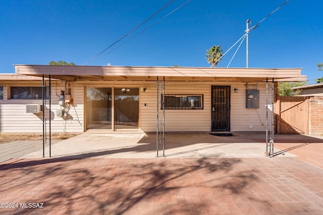 rear view of house with a patio