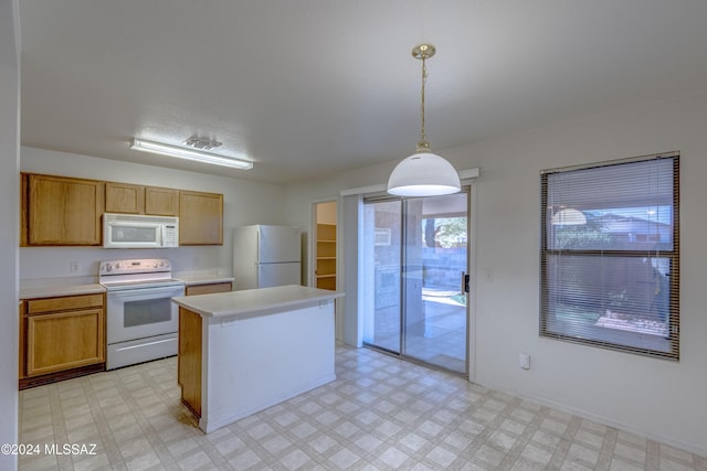 kitchen with a kitchen island, pendant lighting, and white appliances