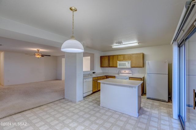 kitchen with light carpet, white appliances, ceiling fan, a center island, and hanging light fixtures