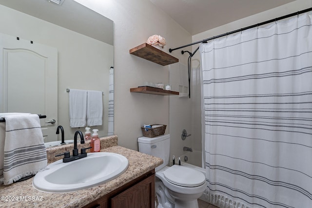 full bathroom featuring shower / tub combo, vanity, and toilet