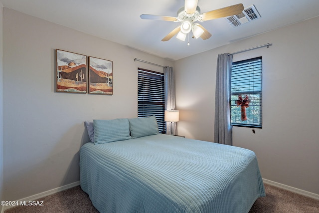 bedroom with ceiling fan and carpet floors