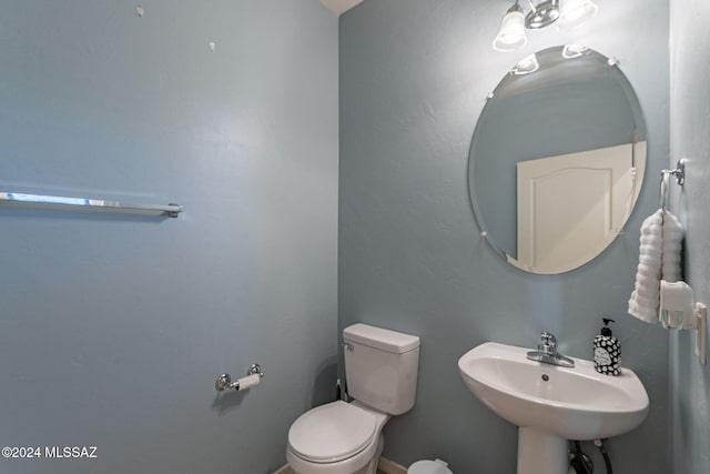 bathroom with toilet and sink