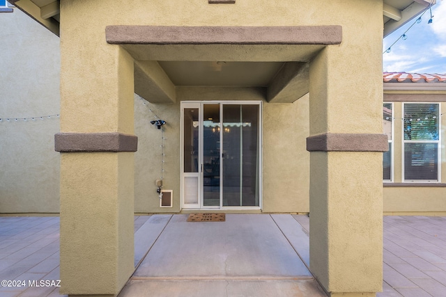 property entrance with a patio