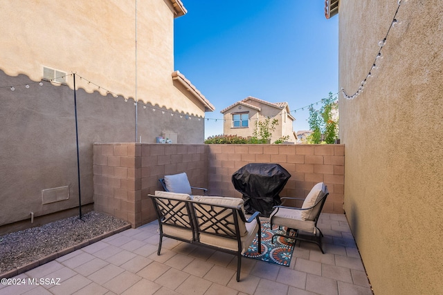 view of patio with a grill and an outdoor hangout area